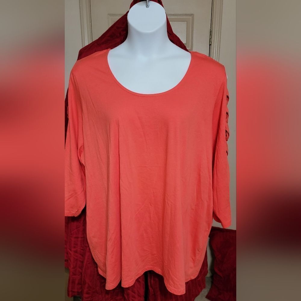 #057 Roaman's Coral top with cutouts on 3-quarter length sleeves.Sze. 30/32W